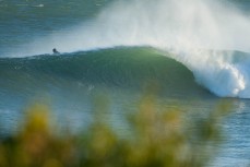 A wave breaks at Blackhead Beach, Dunedin, New Zealand. 