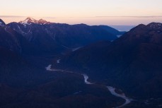Dawn in Fiordland during a helicopter flight into Big Bay, Fiordland National Park, Fiordland, New Zealand. 