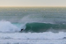 Keo Morrison makes the most of a before school surf at Blackhead, Dunedin, New Zealand. Photo: Derek Morrison