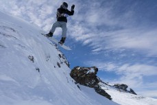 Harry Newcombe drops into a bowl during spring at Cardrona ski field, Cardrona Valley, Wanaka, New Zealand.