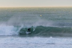 Keo Morrison makes the most of a before school surf at Blackhead, Dunedin, New Zealand. Photo: Derek Morrison
