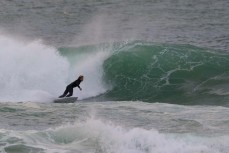 Keo Morrison makes the most of a before school surf at Blackhead, Dunedin, New Zealand. Photo: Derek Morrison