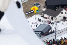A banana tailgrab during the Mini Pipe World Champs held in spring at Cardrona ski field, Cardrona Valley, Wanaka, New Zealand.