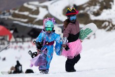 Grommets at the Mini Pipe World Champs held in spring at Cardrona ski field, Cardrona Valley, Wanaka, New Zealand.