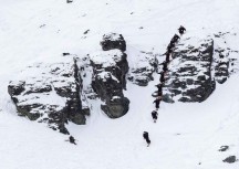 A US freeskier drops a line at Cardrona ski field, Cardrona Valley, Wanaka, New Zealand.