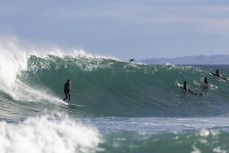 A surfer makes the most of a punchy spring swell at Blackhead, Dunedin, New Zealand.