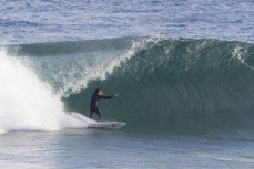 A surfer makes the most of a punchy spring swell at Blackhead, Dunedin, New Zealand.