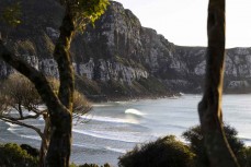Morning glow as peaks wander in at a remote beach break in the Catlins, New Zealand. Photo: Derek Morrison