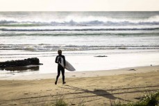 Keo Morrison stumbles across some school holiday fun at a remote beach break in the Catlins, New Zealand. Photo: Derek Morrison