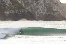 Keo Morrison stumbles across some school holiday fun at a remote beach break in the Catlins, New Zealand. Photo: Derek Morrison