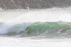Keo Morrison stumbles across some school holiday fun at a remote beach break in the Catlins, New Zealand. Photo: Derek Morrison