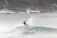 Keo Morrison stumbles across some school holiday fun at a remote beach break in the Catlins, New Zealand. Photo: Derek Morrison