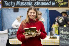 Seafood lover, Taya Morrison, at the 2025 Port Chalmers Seafood Festival held at Port Otago Passenger Terminal, Port Chalmers, Dunedin, New Zealand.Photo: Derek Morrison