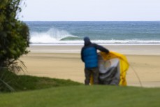 Photographer Scott Sinton setting up camp for a spring swell at a remote beach break on the Catlins coast, Otago, New Zealand. Photo: Derek Morrison