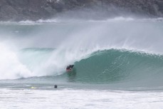 Jeff Patton locked into a barrel during a spring swell at a remote beach break on the Catlins coast, Otago, New Zealand. Photo: Derek Morrison