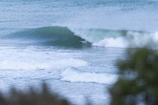 Keo Morrison gets a barrel in a spring swell at a remote beach break on the Catlins coast, Otago, New Zealand. Photo: Derek Morrison