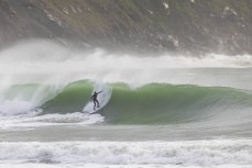 Phil McVeigh gets stuck into a spring swell at a remote beach break on the Catlins coast, Otago, New Zealand. Photo: Derek Morrison