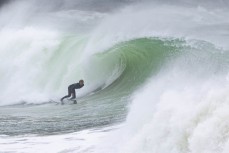 Keo Morrison lines up a barrel in a spring swell at a remote beach break on the Catlins coast, Otago, New Zealand. Photo: Derek Morrison