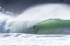 Finn Vette gets a tube during a spring swell at a remote beach break on the Catlins coast, Otago, New Zealand. Photo: Derek Morrison
