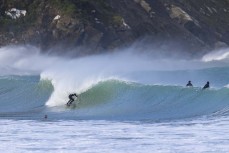 Kaino gets tubed during a spring swell at a remote beach break on the Catlins coast, Otago, New Zealand. Photo: Derek Morrison