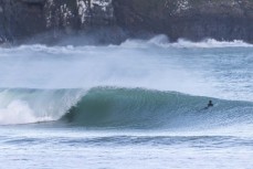 Finn Vette gets a tube during a spring swell at a remote beach break on the Catlins coast, Otago, New Zealand. Photo: Derek Morrison
