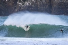 Finn Vette gets pitched during a spring swell at a remote beach break on the Catlins coast, Otago, New Zealand. Photo: Derek Morrison