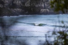 Finn Vette gets a tube during a spring swell at a remote beach break on the Catlins coast, Otago, New Zealand. Photo: Derek Morrison