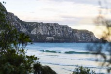 Keo Morrison gets a barrel in a spring swell at a remote beach break on the Catlins coast, Otago, New Zealand. Photo: Derek Morrison