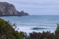 Keo Morrison slotted during a spring swell at a remote beach break on the Catlins coast, Otago, New Zealand. Photo: Derek Morrison