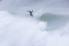 Ejected during a spring swell at a remote beach break on the Catlins coast, Otago, New Zealand. Photo: Derek Morrison