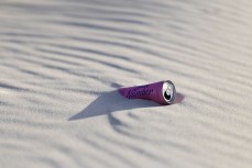 Trash discarded in the dunes at Smaills Beach, Dunedin, New Zealand.