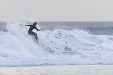Jack Higgins makes the most of a small summer swell at Blackhead Beach, Dunedin, New Zealand.Photo: Derek Morrison
