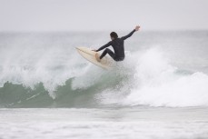 Ethan Wardrop makes the most of a small summer swell aty Blackhead Beach, Dunedin, New Zealand.Photo: Derek Morrison
