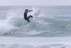 Keo Morrison makes the most of a small summer swell aty Blackhead Beach, Dunedin, New Zealand.Photo: Derek Morrison