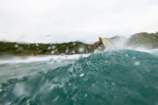 Simon Dickie during a fun summer swell at Blackhead, Dunedin, New Zealand.