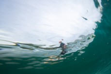 Simon Dickie during a fun summer swell at Blackhead, Dunedin, New Zealand.