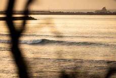 A small swell arrives on dusk at Belt Road, New Plymouth, Taranaki, New Zealand.