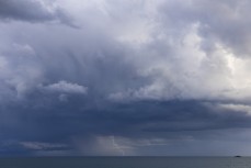 Lightning bolt out to sea as summer storm clouds roll around St Clair, Dunedin, New Zealand.Photo: Derek Morrison