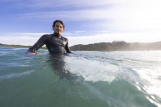 Musician Ocean Temple-Wilson bleeding in the lineup on a Christmas morning surf at Blackhead, Dunedin, New Zealand.
