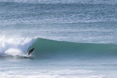 Sam Todd puts his new board through its paces during a fun swell at St Kilda, Dunedin, New Zealand.Photo: Derek Morrison
