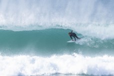 Keo Morrison gets barelled during a fun swell at St Kilda, Dunedin, New Zealand.Photo: Derek Morrison