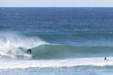 Keo Morrison gets barelled during a fun swell at St Kilda, Dunedin, New Zealand.Photo: Derek Morrison