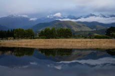 Reflections in floodwater at a surf break near Kaikoura, New Zealand. Photo: Derek Morrison