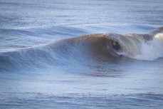 Keo Morrison gets tubed at the Westport Breakwater, Westport, West Coast, New Zealand.