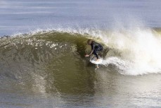 Jai Earnshaw gets barreled at the Westport Breakwater, Westport, West Coast, New Zealand.