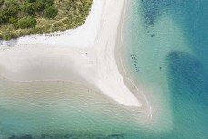 Clear blue water at the Otago Harbour mouth, Otago Peninsula, Dunedin, New Zealand.