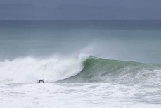 Muso Sam Charlesworth revelling in the juice during a swell on the north coast of Dunedin, New Zealand.