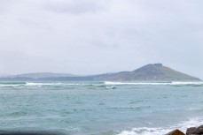 Remote empty lineup during a swell on the north coast of Dunedin, New Zealand.