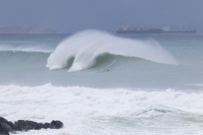 Jimmy Crooks and Tom Bracegirdle hunt in a large arena at a remote lineup during a swell on the north coast of Dunedin, New Zealand.
