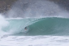 Keo Morrison making the most of a swell on the north coast of Dunedin, New Zealand.